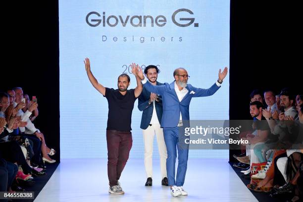 Fikri Temel , Deniz Senoglu and Tulug Ozgur are applauded on the runway at the Giovane Gentile show during Mercedes-Benz Istanbul Fashion Week...
