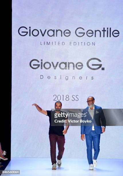 Fikri Temel and Tulug Ozgur are applauded on the runway at the Giovane Gentile show during Mercedes-Benz Istanbul Fashion Week September 2017 at...