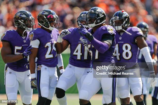 Mosley of the Baltimore Ravens celebrates with teammates after a interception against the Cincinnati Bengals at Paul Brown Stadium on September 10,...