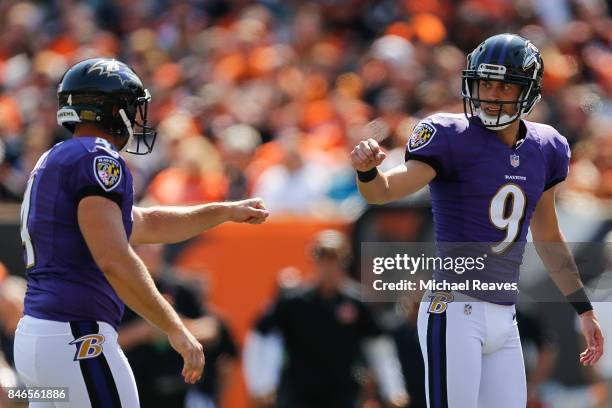 Justin Tucker of the Baltimore Ravens celebrates with Sam Koch after kicking a field goal during the game against the Cincinnati Bengals at Paul...