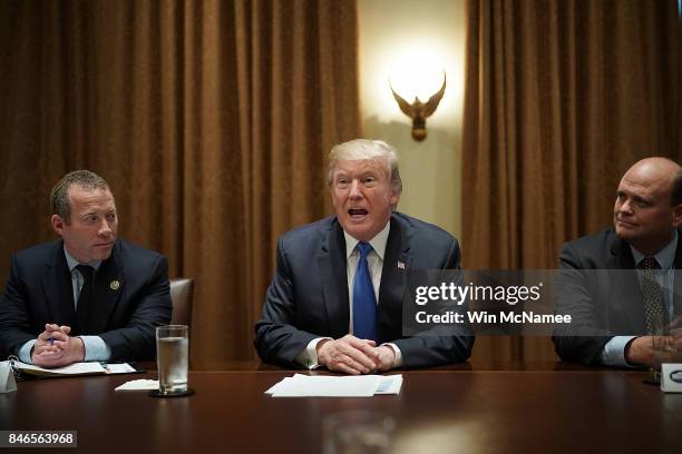 President Donald Trump meets with Democratic and Republican members of Congress, including Rep. Josh Gottheimer and Rep. Tom Reed , in the Cabinet...