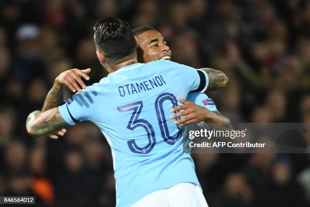 Manchester City's Brazilian striker Gabriel Jesus celebrates with Manchester City's Argentinian defender Nicolas Otamendi after scoring a goal during...