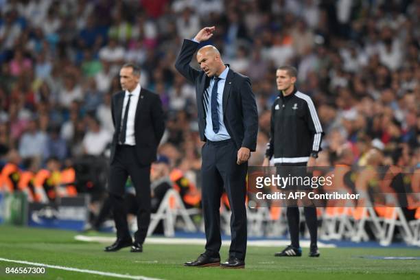 Real Madrid's coach from France Zinedine Zidane gestures during the UEFA Champions League football match Real Madrid CF vs APOEL FC at the Santiago...