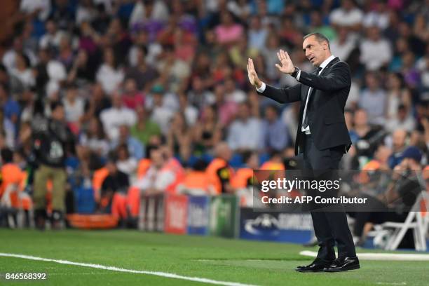 Nicosia's coach from Greece Giorgos Donis gestures during the UEFA Champions League football match Real Madrid CF vs APOEL FC at the Santiago...