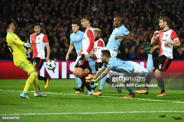 Manchester City's Argentinian defender Nicolas Otamendi heads the ball during the UEFA Champions League Group F football match between Feyenoord...