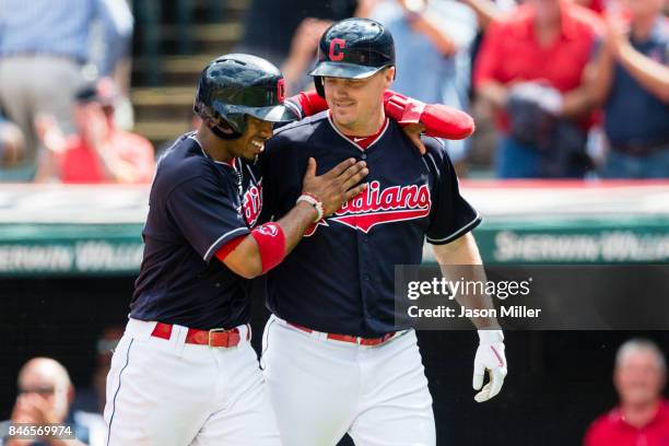 Francisco Lindor celebrates with Jay Bruce of the Cleveland Indians after both scored during the first inning on a home run by Bruce at Progressive...