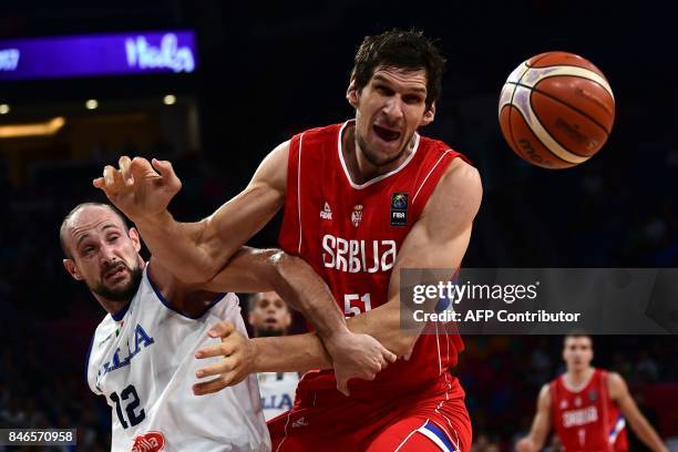 Serbia`s centre Boban Marjanovic fights for the ball with Italy`s centre Marco Cusin during the FIBA Eurobasket 2017 men's quarter-final basketball...