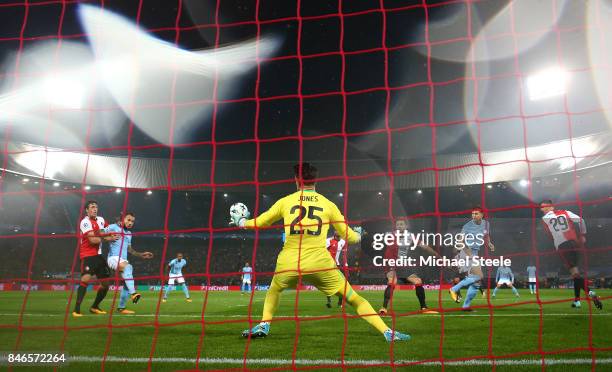 John Stones of Manchester City scores his sides first goal during the UEFA Champions League group F match between Feyenoord and Manchester City at...