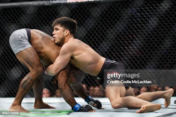 Henry Cejudo, right, fights Wilson Reis during UFC 215 at Rogers Place on September 9, 2017 in Edmonton, Canada.