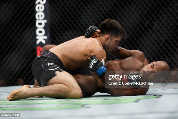 Henry Cejudo, left, fights Wilson Reis during UFC 215 at Rogers Place on September 9, 2017 in Edmonton, Canada.