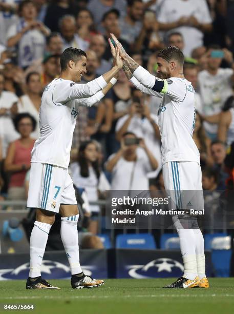Cristiano Ronaldo of Real Madrid celebrates with Sergio Ramos after scoring the opening goal during the UEFA Champions League group H match between...