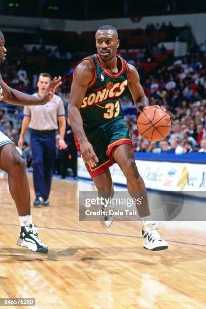 Hersey Hawkins of Seattle SuperSonics drives against the Minnesota Timberwolves circa 1996 at the Target Center in Minneapolis, Minnesota. NOTE TO...