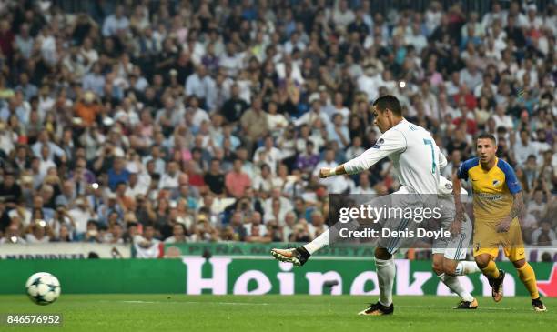 Cristiano Ronaldo of Real Madrid scores his sides second goal during the UEFA Champions League group H match between Real Madrid and APOEL Nikosia at...