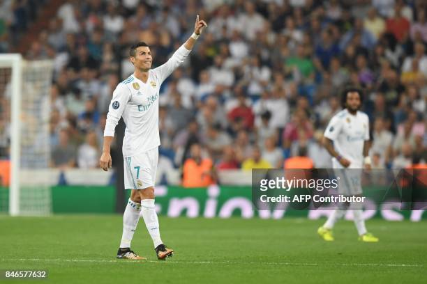 Real Madrid's forward from Portugal Cristiano Ronaldo celebrates after scoring during the UEFA Champions League football match Real Madrid CF vs...