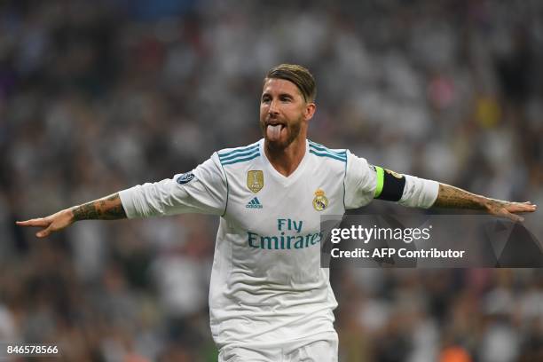 Real Madrid's defender from Spain Sergio Ramos celebrates after scoring during the UEFA Champions League football match Real Madrid CF vs APOEL FC at...