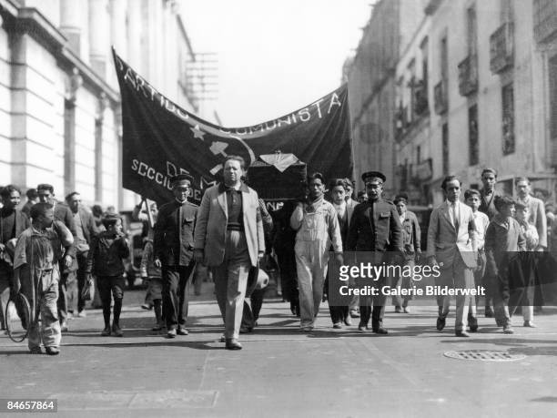 Mexican artist Diego Rivera leads the funeral procession of assassinated Cuban revolutionary Julio Antonio Mella through Mexico City, January 1929.