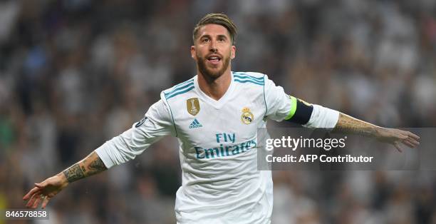 Real Madrid's defender from Spain Sergio Ramos celebrates after scoring during the UEFA Champions League football match Real Madrid CF vs APOEL FC at...