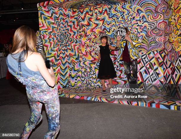 Alexa Meade photographing her artwork at Refinery29's "29Rooms: Turn It Into Art" at 106 Wythe Ave on September 7, 2017 in New York City.