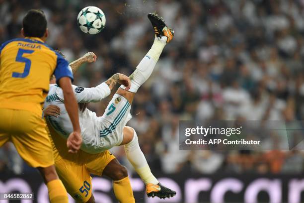 Real Madrid's defender from Spain Sergio Ramos kicks the ball during the UEFA Champions League football match Real Madrid CF vs APOEL FC at the...