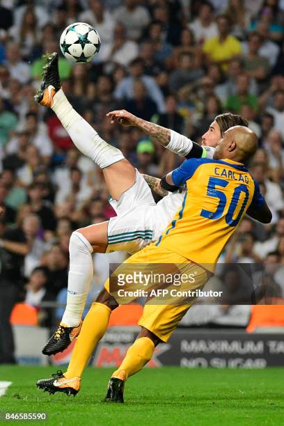 Real Madrid's defender from Spain Sergio Ramos scores during the UEFA Champions League football match Real Madrid CF vs APOEL FC at the Santiago...