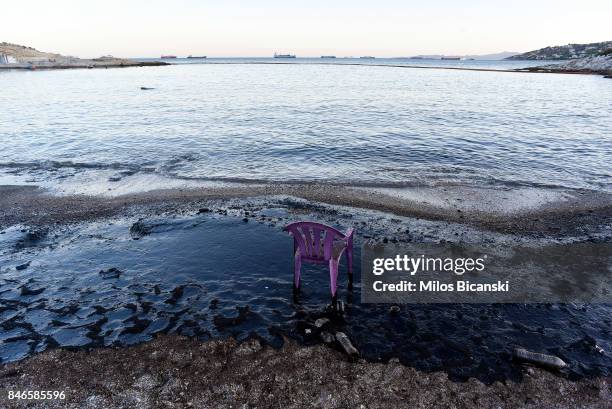 Plastic chair stands on a polluted beach on the coast of Salamis Island on September 13, 2017 in Salamis, Greece. The small tanker 'Agia Zoni II'...