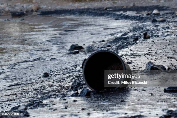 Bucket loes on a polluted beach on the coast of Salamis Island on September 13, 2017 in Salamis, Greece. The small tanker 'Agia Zoni II' sank on...