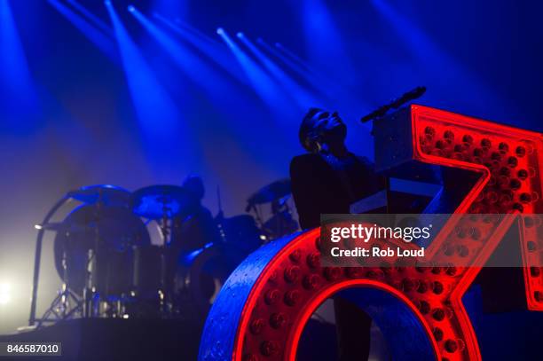 Ronnie Vannuci and Brandon Flowers or The Killers perform live on stage at Brixton Academy on September 12, 2017 in London, England.