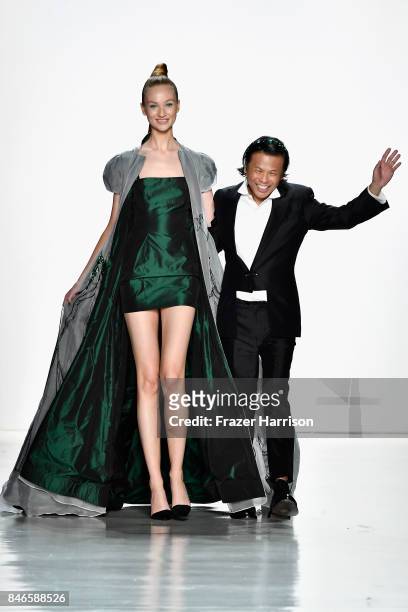 Designer Zang Toi walks the runway with a model at the Zang Toi fashion show during New York Fashion Week: The Shows at Gallery 3, Skylight Clarkson...