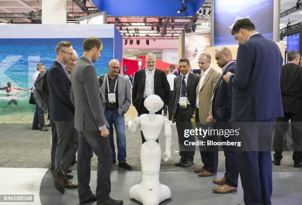 Attendees watch Pepper the humanoid robot, manufactured by SoftBank Group Corp., during the Mobile World Conference Americas event in San Francisco,...