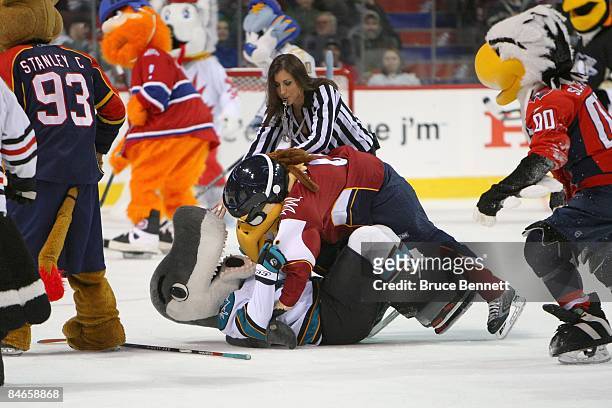 Atlanta Thrashers mascot 'Thrash' wrestles down San Jose Sharks mascot 'S.J. Sharkie' during the McDonalds/NHL All-Star Open Practice during the 2009...