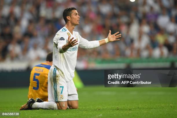 Real Madrid's forward from Portugal Cristiano Ronaldo falls during the UEFA Champions League football match Real Madrid CF vs APOEL FC at the...