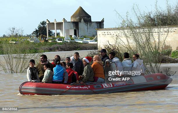 Residents being evacuated in Sidi Slimane, near Kenitra on February 5 as a result of the overflooding of the Oued Beht river following heavy...