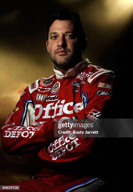 Tony Stewart, driver of the Old Spice/Office Depot Chevrolet, poses during NASCAR media day at Daytona International Speedway on February 5, 2009 in...