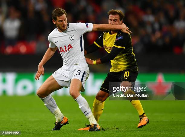 Jan Vertonghen of Tottenham Hotspur and Mario Gotze of Borussia Dortmund battle for possession during the UEFA Champions League group H match between...
