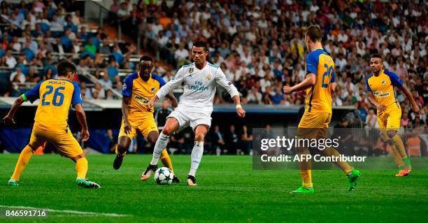 Real Madrid's forward from Portugal Cristiano Ronaldo controls the ball during the UEFA Champions League football match Real Madrid CF vs APOEL FC at...