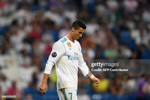 Real Madrid's forward from Portugal Cristiano Ronaldo leaves the pitch after the UEFA Champions League football match Real Madrid CF vs APOEL FC at...
