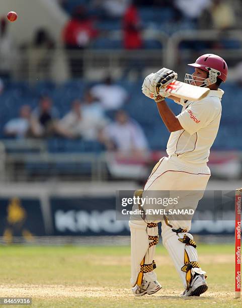 West Indies cricketer Ramnaresh Sarwan hits the ball off England's bowler Steve Harmison during the second day of the first Test match between...