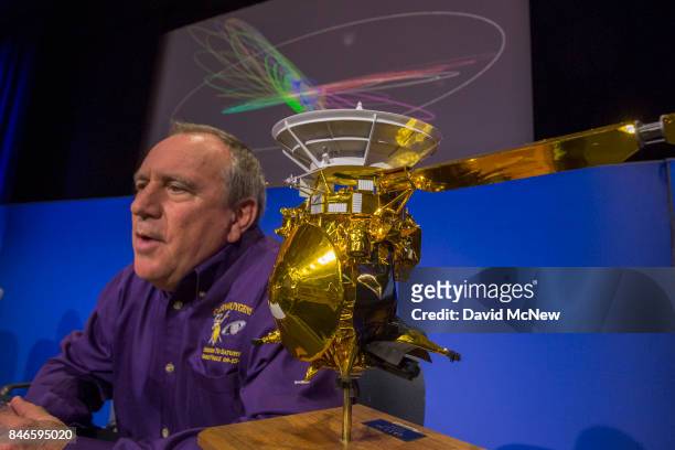 Team Lead for Cassini Ion and Neutral Mass Spectrometer, Southwest Research institute, Hunter Waite, speaks next to a model of of NASA's Cassini...