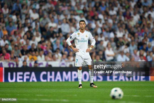 Real Madrid's forward from Portugal Cristiano Ronaldo eyes the ball during the UEFA Champions League football match Real Madrid CF vs APOEL FC at the...