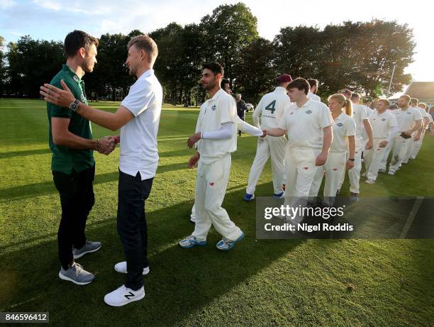 England cricketers Joe Root and James Anderson react with players after the Brut T20 Cricket match betweenTeam Jimmy and Team Joe at Worksop College...