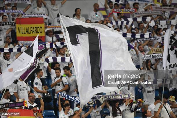 Real Madrid's fans wave a giant flag with the number "7" of Real Madrid's forward from Portugal Cristiano Ronaldo before the UEFA Champions League...