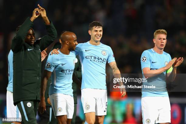 Fabian Delph, John Stones and Kevin De Bruyne of Manchester City celebrate victory after the UEFA Champions League group F match between Feyenoord...