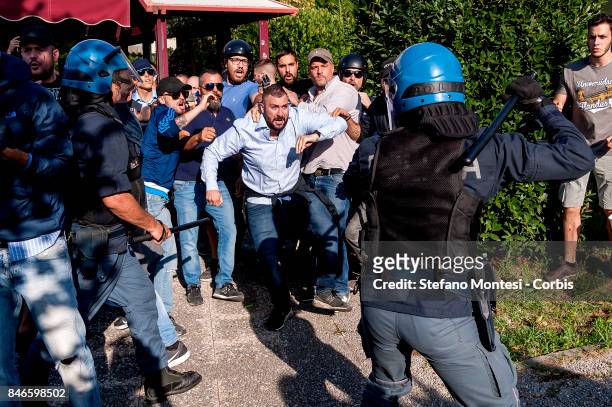 Police attempt to control Casapound's extreme right-wing militants as they clash with the anti-fascists in front of the Fourth Town Hall, where the...