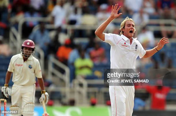 West Indies cricketer Ramnaresh Sarwan looks on as England's bowler Stuart Broad unsuccessfully appeals for dismissal decision against him during the...