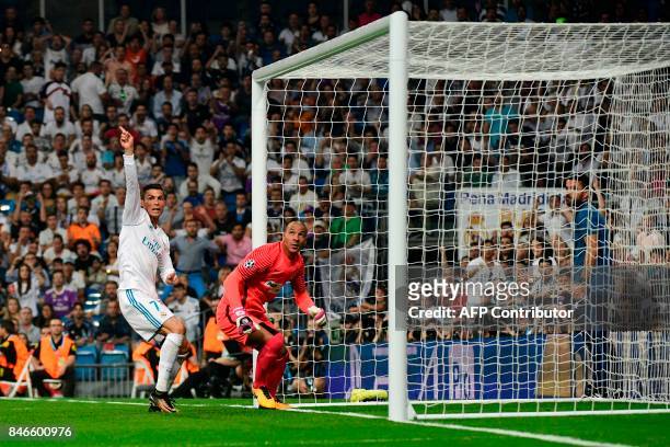 Real Madrid's forward from Portugal Cristiano Ronaldo gestures past APOEL Nicosia's goalkeeper from the Netherlands Boy Waterman after a cancelled...