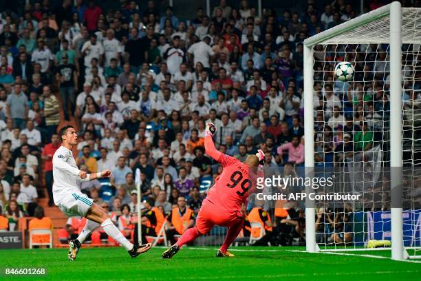 Real Madrid's forward from Portugal Cristiano Ronaldo scores a goal to APOEL Nicosia's goalkeeper from the Netherlands Boy Waterman that will be...