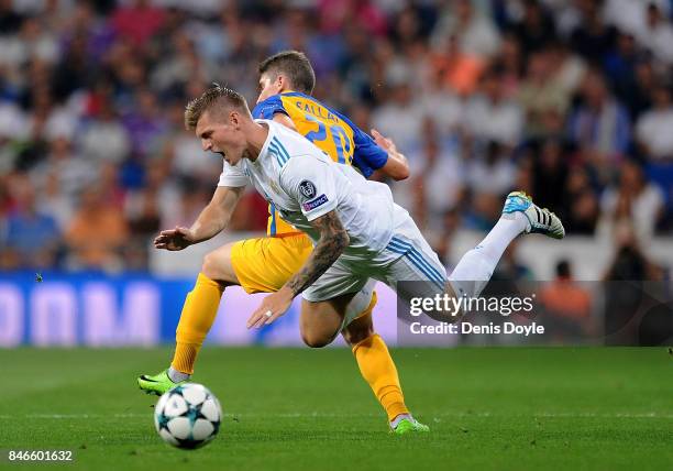 Roland Sallai of Apoel FC fouls Toni Kroos of Real Madrid during the UEFA Champions League group H match between Real Madrid and APOEL Nikosia at...