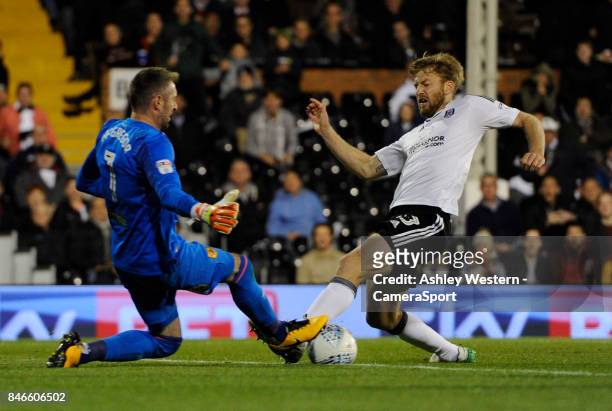 Fulham's Tim Ream battles for possession with Hull City's Allan McGregor during the Sky Bet Championship match between Fulham and Hull City at Craven...