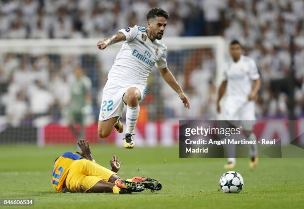 Isco of Real Madrid jumps over Vinicius of APOEL Nikosia during the UEFA Champions League group H match between Real Madrid CF and APOEL Nikosia at...