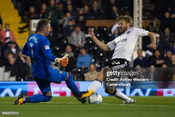 Fulham's Tim Ream battles for possession with Hull City's Allan McGregor during the Sky Bet Championship match between Fulham and Hull City at Craven...